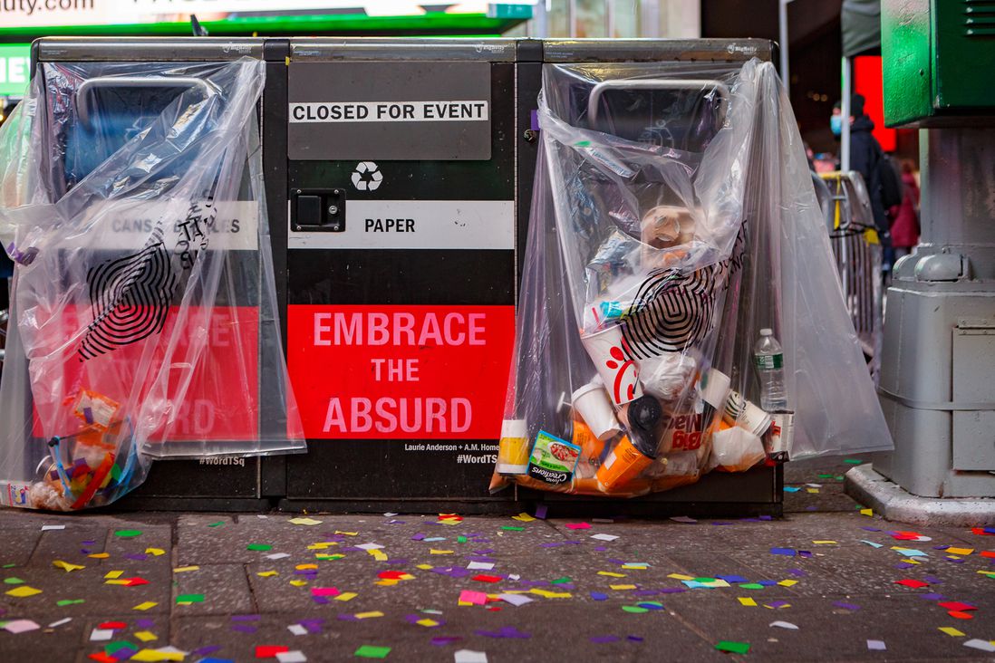 A garbage can that says "Embrace the Absurd"